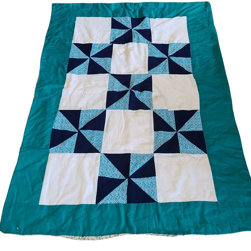 Hand stitched pinwheel quilt